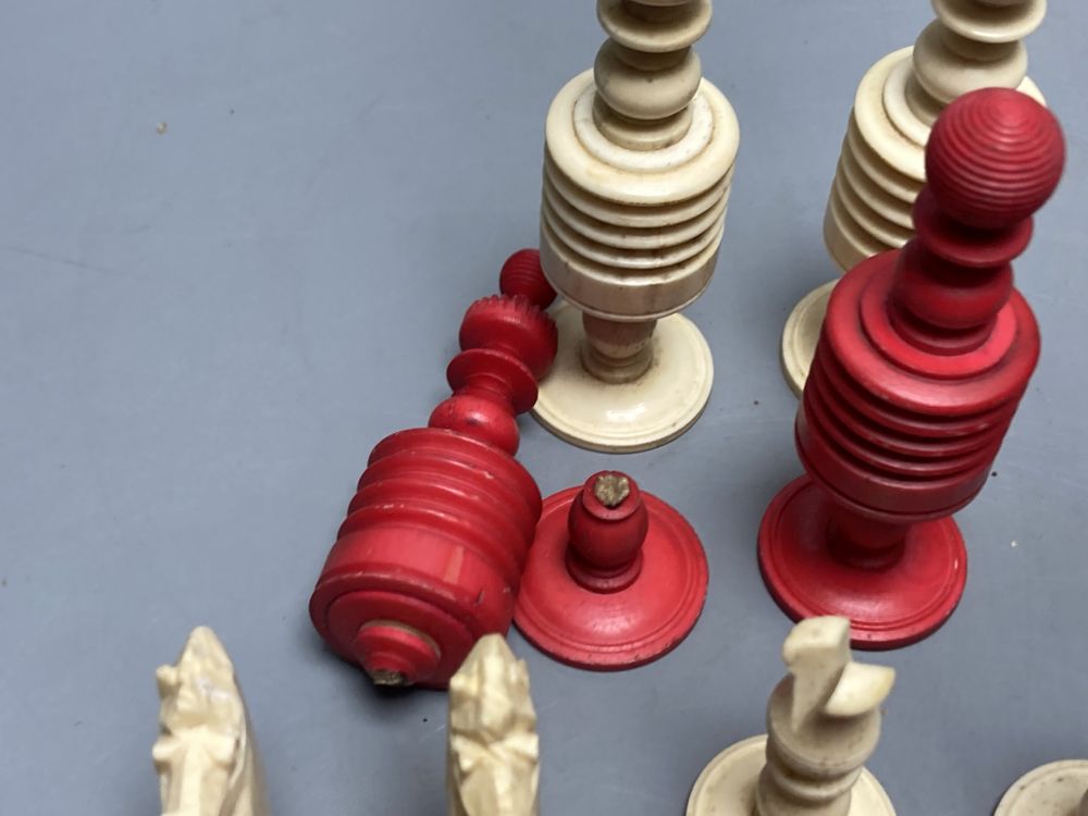 A late 19th century stained natural bone chess set